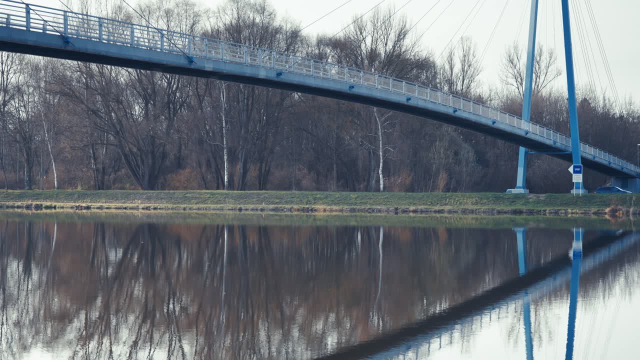 Bridge over Water with Tree Reflections