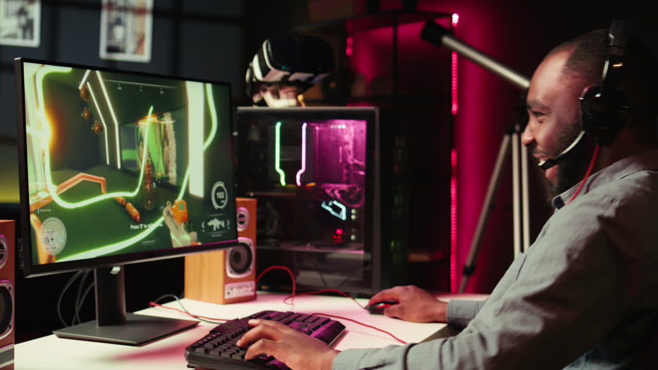 Player using keyboard, mouse and headset to play first person shooter videogame