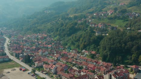 Aerial-View-Of-Townscape-With-Lush-Foliage-And-Vegetation-In-Ivanjica,-Serbia---aerial-drone-shot