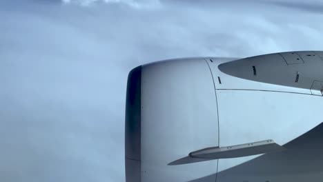 view of the planes engine and serene sky in porto, portugal during a sunny flight