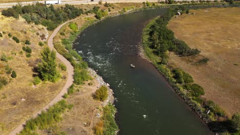 Colorado-Rocky-Mountains-Rafting-On-River-Pan-Down-Aerial-Shot-4K