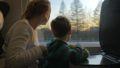 Mother-and-son-commuting-by-train