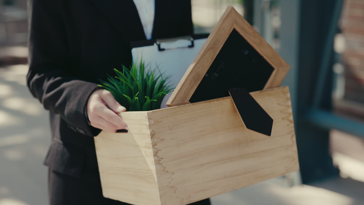 Woman Leaving a Job with Documents and Items