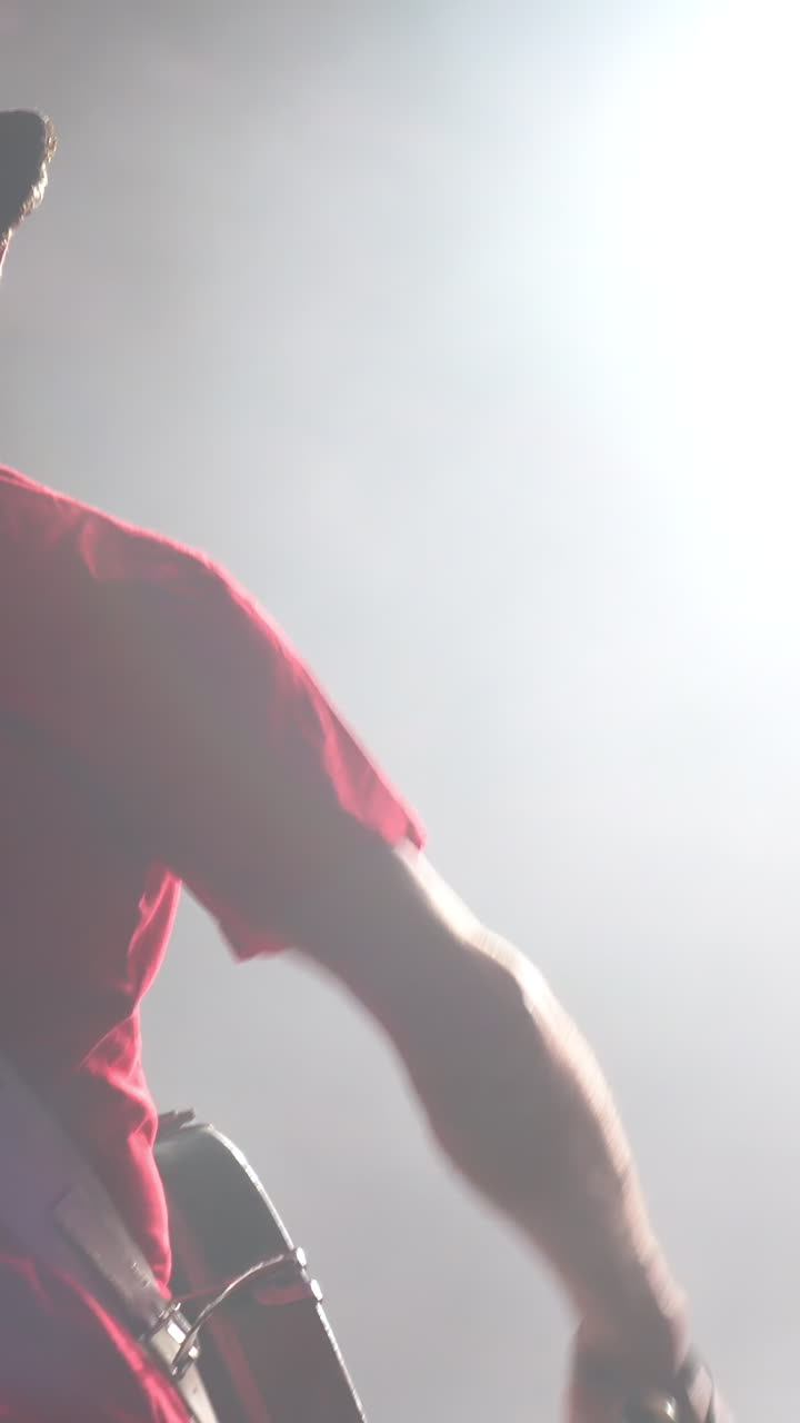 Musician Playing Guitar on Stage