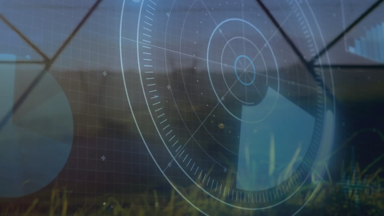 Wind turbine tower spinning in field while flat design digital gauges and charts overlaying scene