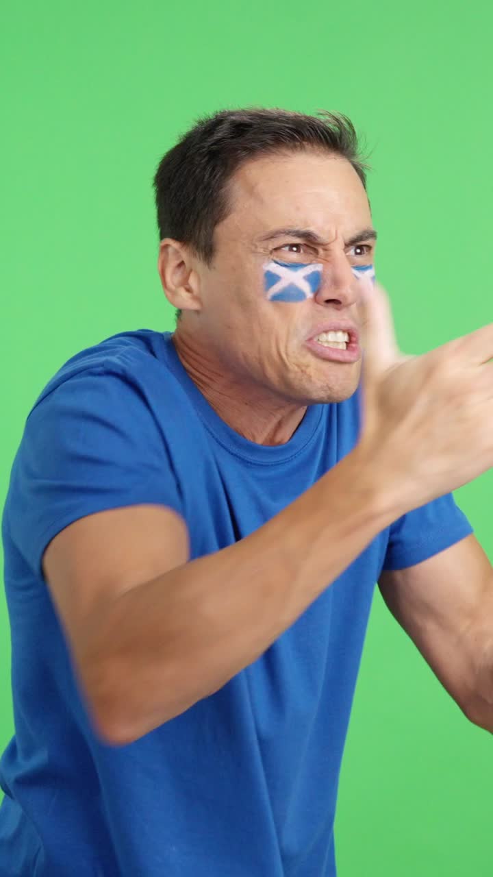 Man cheering for Scotland, angry with the decision of referee