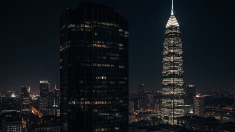 night view of a city skyline with illuminated skyscrapers