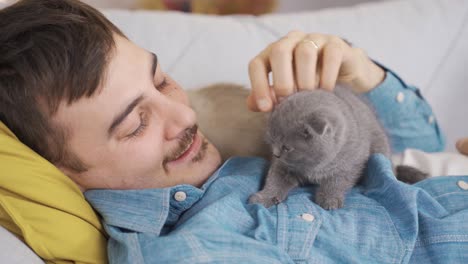 the cat loves its owner and is with him even when he is sleeping.