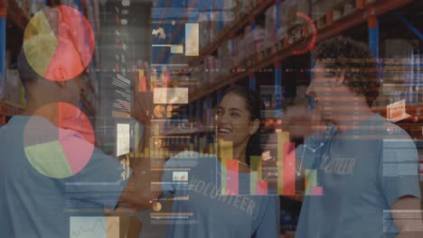 Screens-with-data-processing-against-male-and-female-volunteers-high-fiving-each-other-at-warehouse