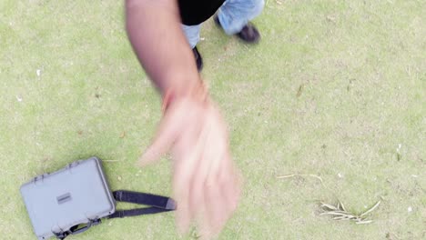 returning a drone and catching with hands in a garden