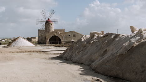 ancient windmill and salt flats in sicily