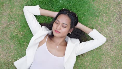 woman relaxing on grass