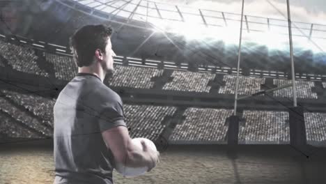jugador de rugby con una pelota de fútbol