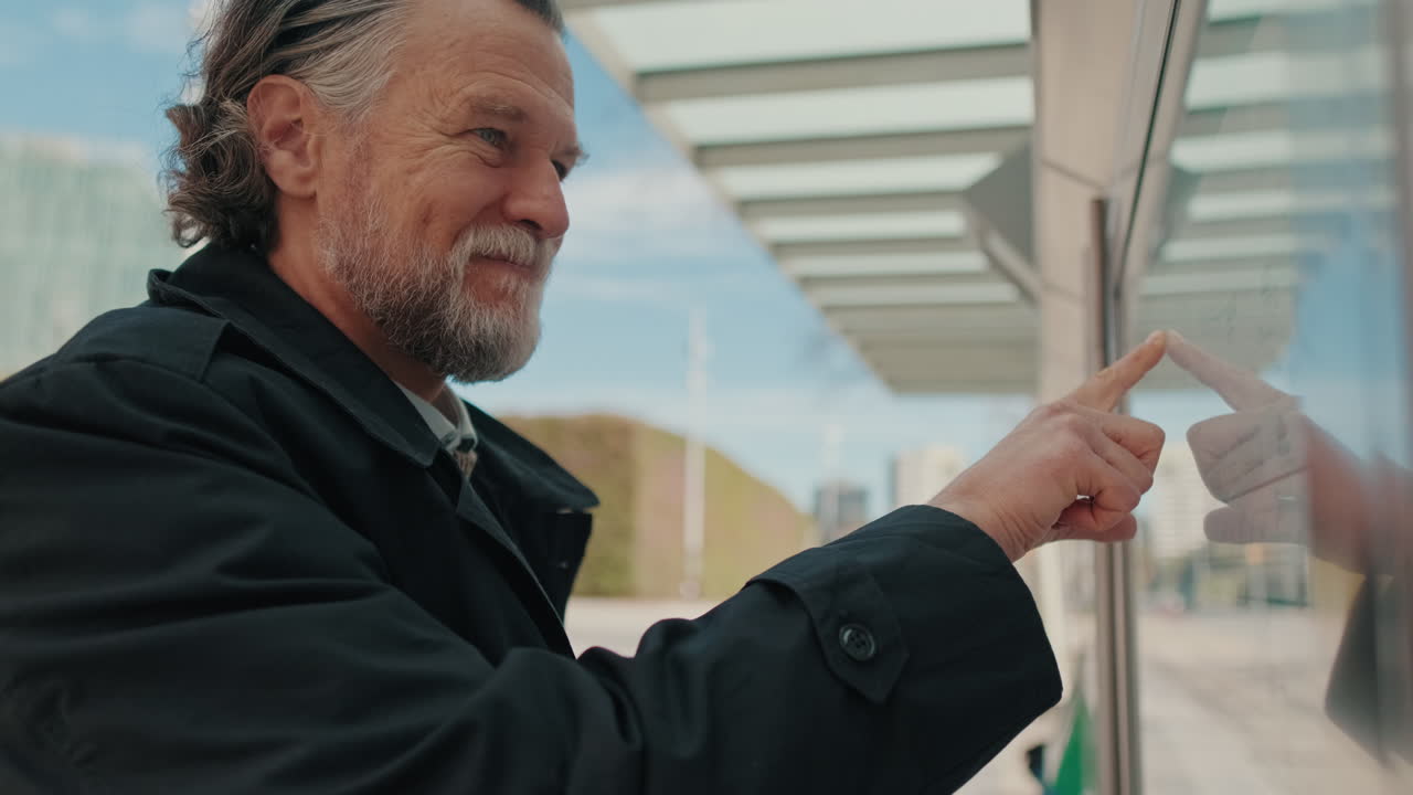 Businessman Uses Interactive Display in the City