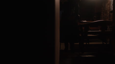 plague doctor in a dark room