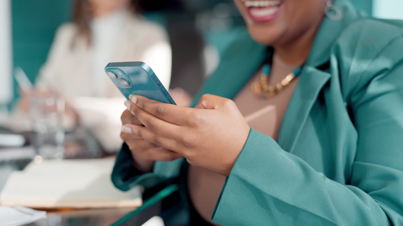 Businesswoman using smartphone during a meeting