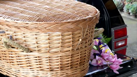 closeup shot of a funeral casket in a hearse or chapel or burial at cemetery