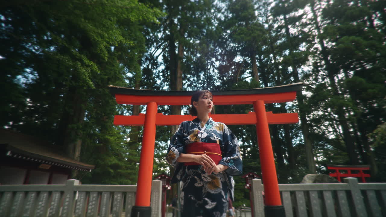 Woman in Kimono at Torii Gate