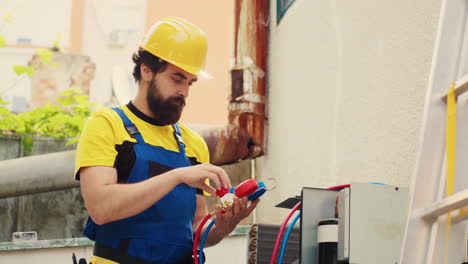 hvac repairman adjusts pressure levels