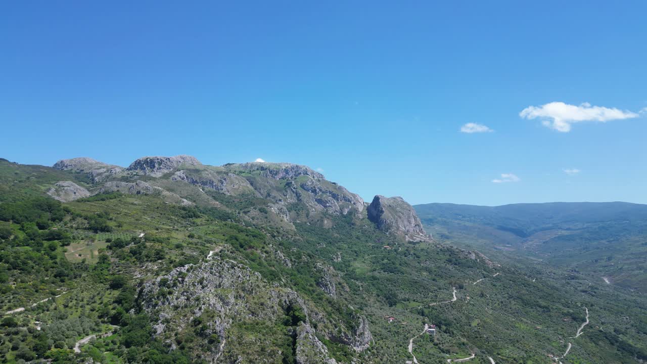 Aerial drone footage of Alcara Li Fusi, Sicily: mountain village, rocky peaks, lush valleys and wild Nebrodi landscapes. Ideal for travel, nature and scenic stock footage