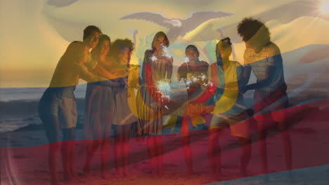 animation of flag of ecuador waving over diverse friends enjoying at beach with sparklers