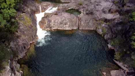 aerial pan up view along behana gorge with reveal of clamshell falls