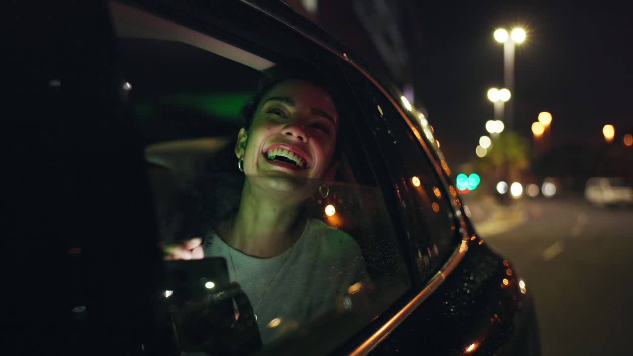 Woman riding in a car at night