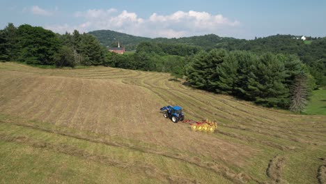 hay field at harvest time with church in background near boone nc, north carolina