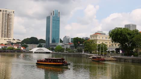 tourist boat cruising along a city river.