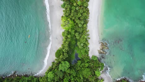 flyover scenic tropical lagoon dual beaches with lush green jungle in middle, aerial drone flyover 4k costa rica