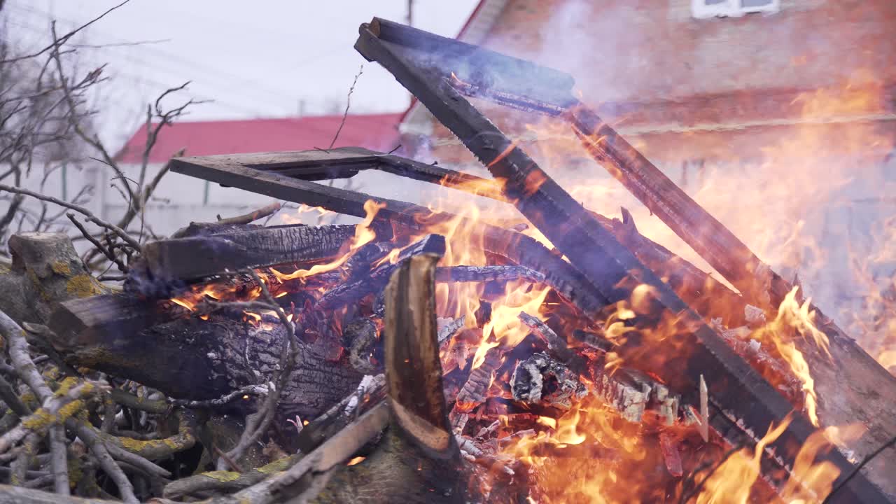 burning doors in the background of the house