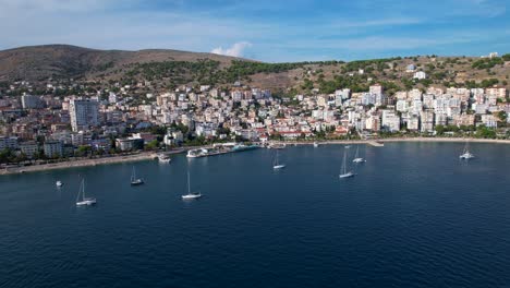 panoramic blue bay of saranda, yachts grace the beautiful coastal vista, inviting vacationers to embrace summer by the sea