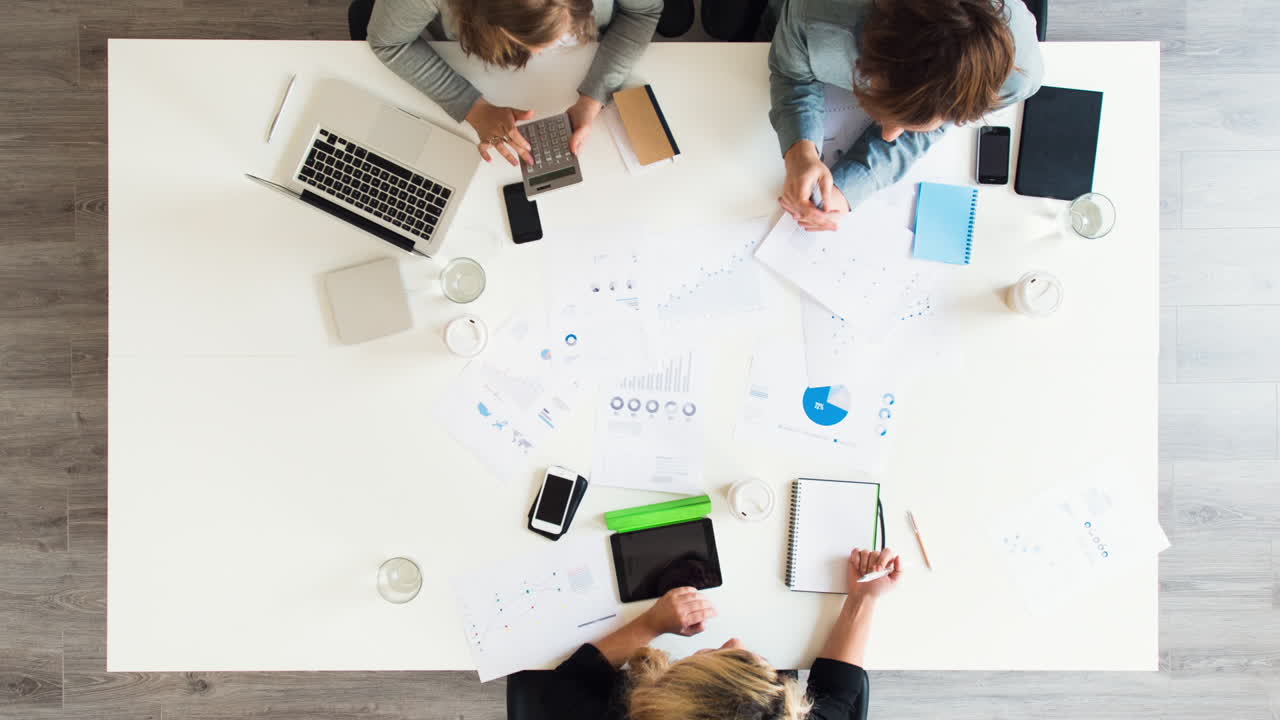 Diverse group of people aerial view timelapse creative business meeting planning thinking ahead startup company