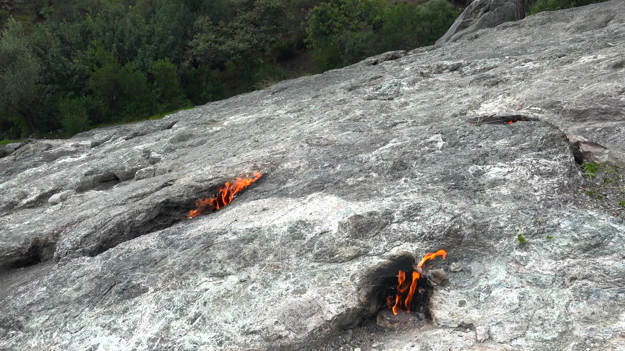 Natural Eternal Flames Burning from Rocky Ground