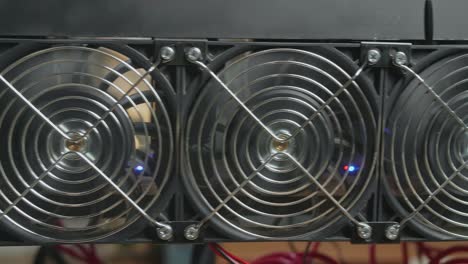 close up fan of cryptocurrency mining rig working