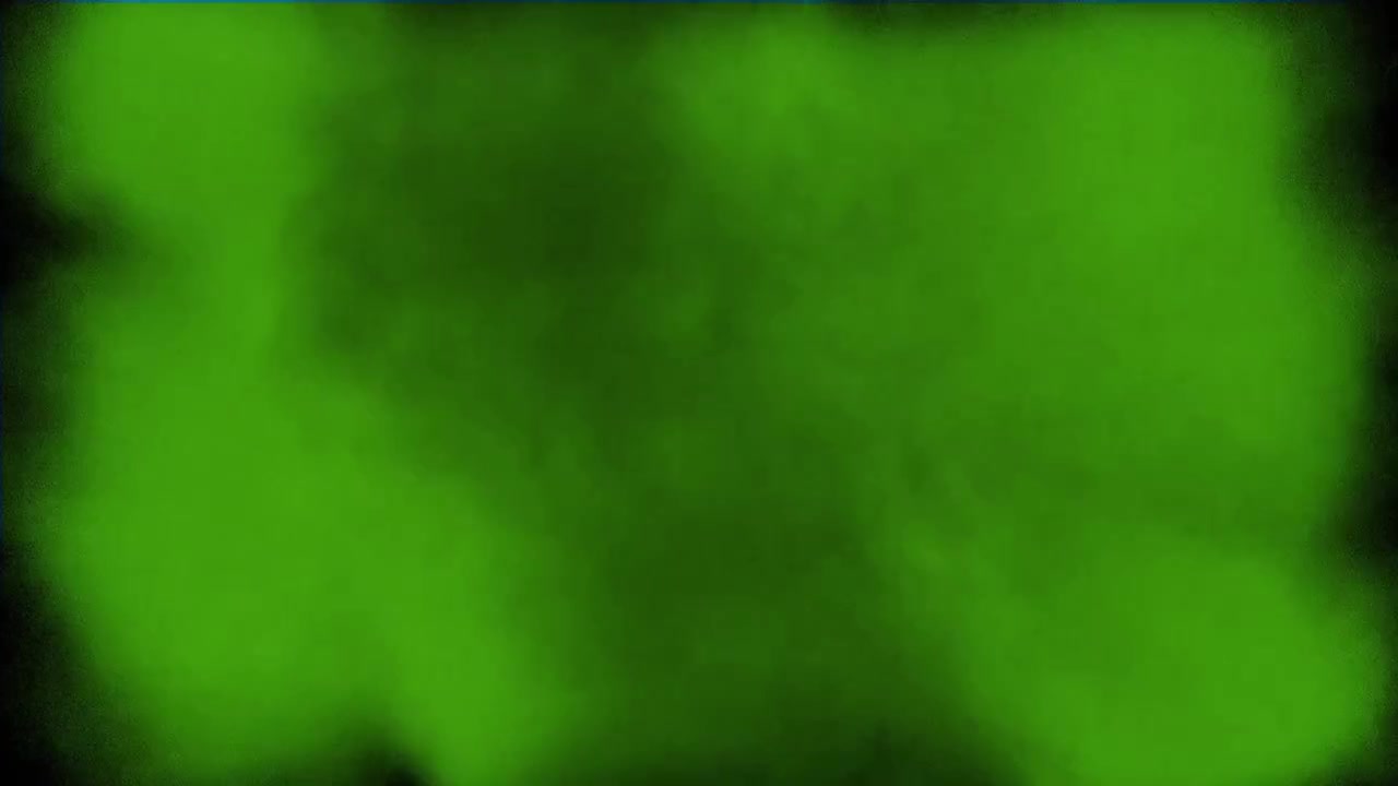 Grøn pulvereksplosion mod sort baggrund