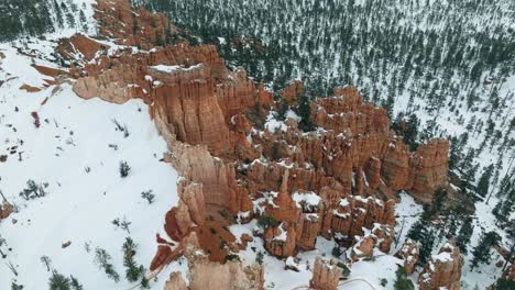 unique rock formations in bryce canyon national park during winter in utah, usa - aerial shot