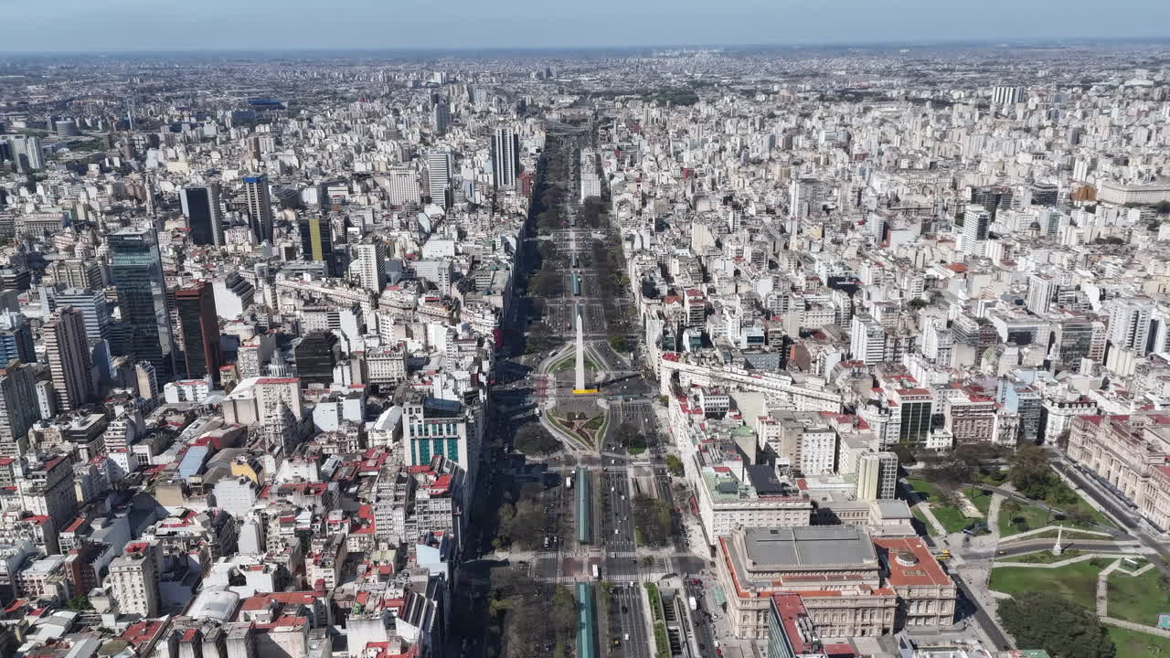 Stunning hyperlapse of the Obelisco and the city around in Buenos Aires, daylight, pan drone shot