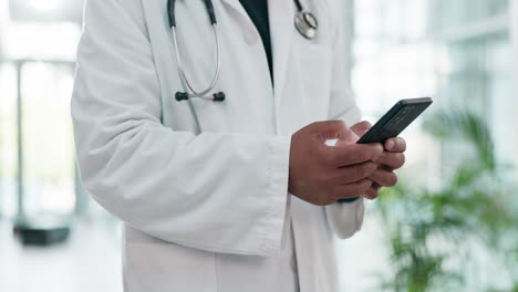 Phone,-medical-and-hands-of-doctor-in-hospital