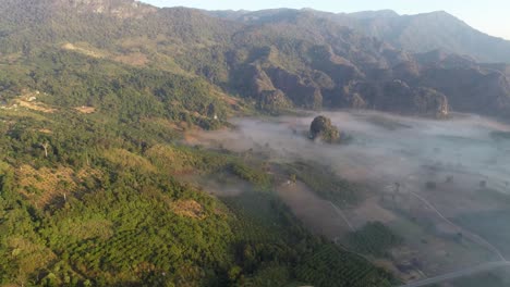 AERIAL-Foggy-Alpine-Landscape-Of-Phu-Langka,-Phayao,-Thailand