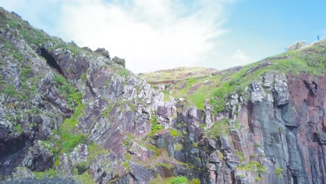 Drone-shot-of-lava-cliff-face-with-amazing-geological-rock-formations