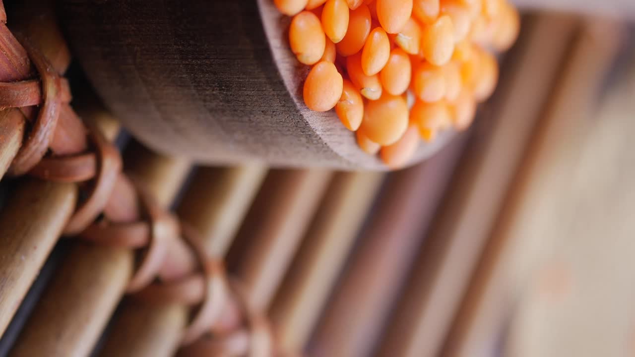Close-up of Red Lentils in a Wooden Bowl