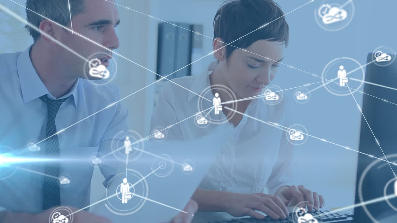 animación de una red de conexiones sobre una mujer y un hombre caucásicos trabajando en una computadora portátil en la oficina