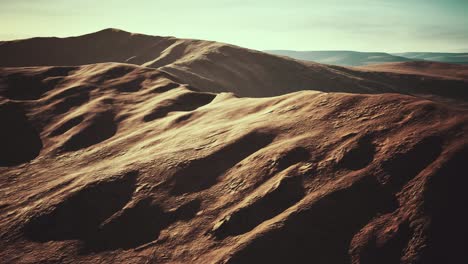 aerial view of red desert with sand dune