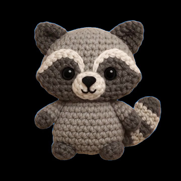 Sød håndlavet hæklet vaskebjørn amigurumi-legetøj