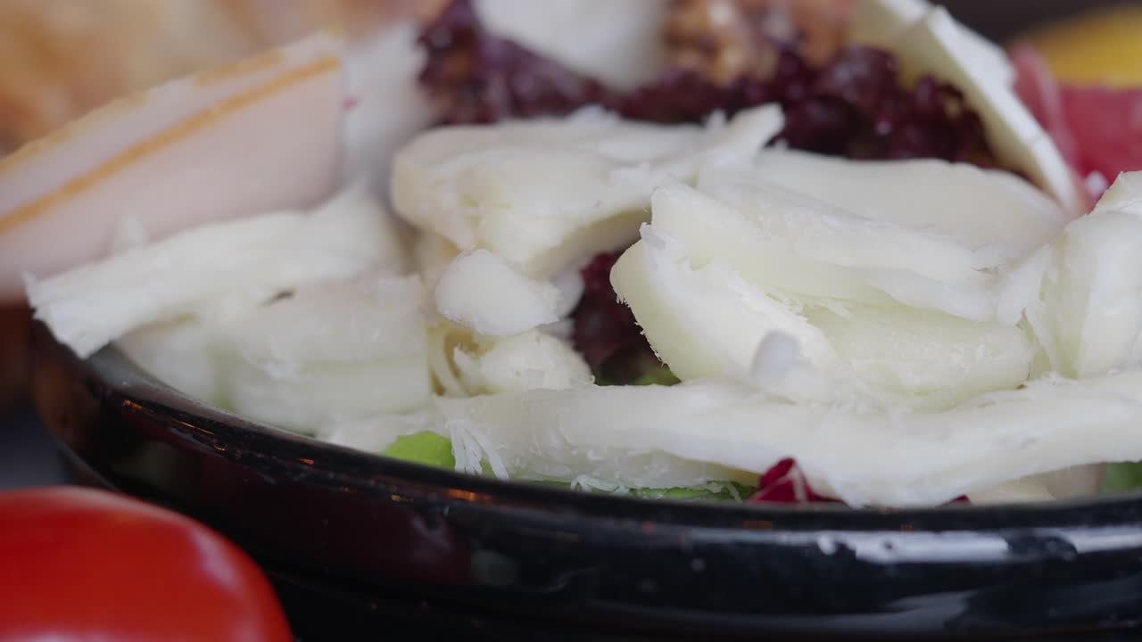 Gourmet Salad with Shaved Cheese, Cured Meats, and Fresh Vegetables