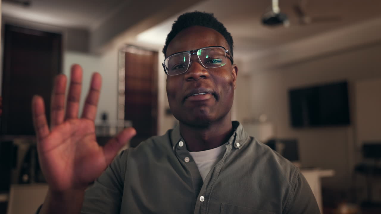 Face, video call and hello of black man in home