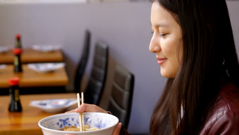 woman having soup in restaurant 4k