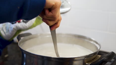 Mom-stirring-a-pot-of-boiling-water-in-slow-motion