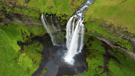 aerial downwards view of seljalandsfoss waterfall in iceland